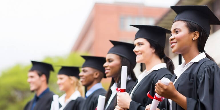 Graduates Holding Diplomas in a Line
